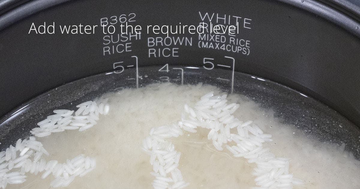 water inside rice cooker to level of markings for rice type and number of cups 